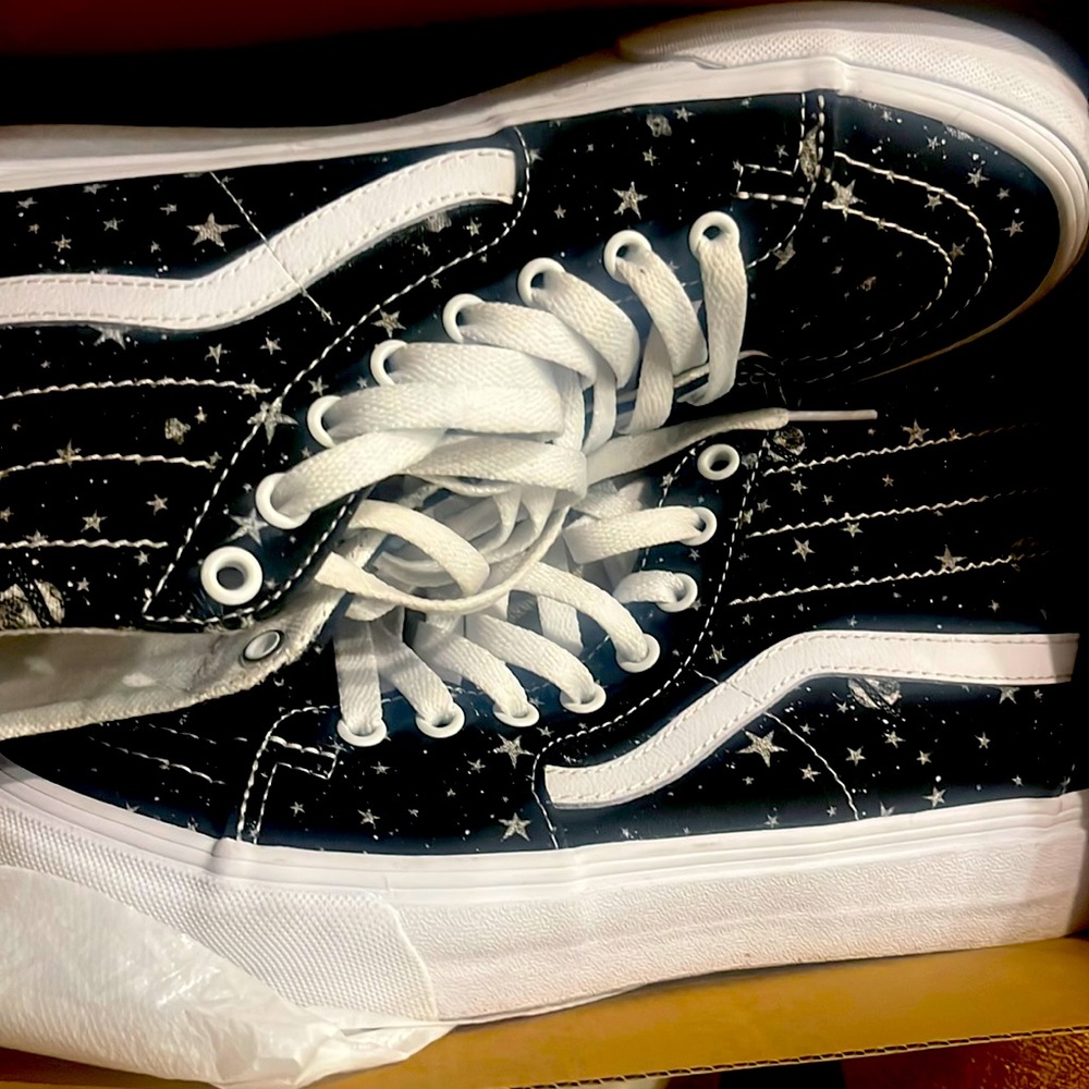 Womens 9.5 black and white star vans worn once. Like new